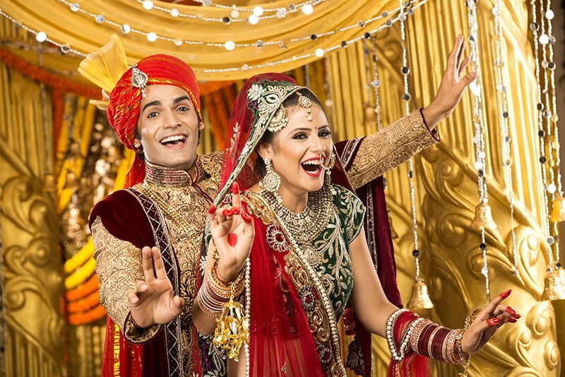 indian bride and groom dancing