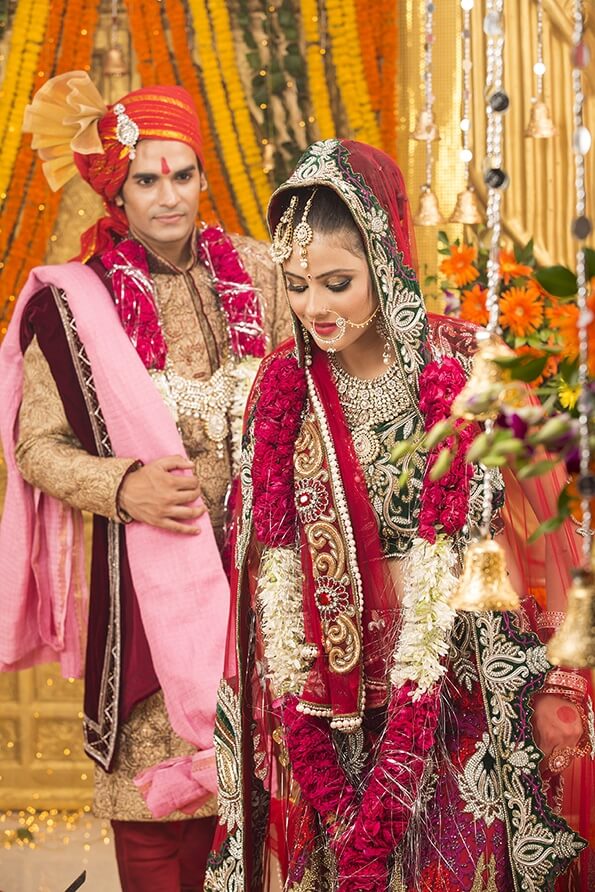 indian bride and groom taking pheras