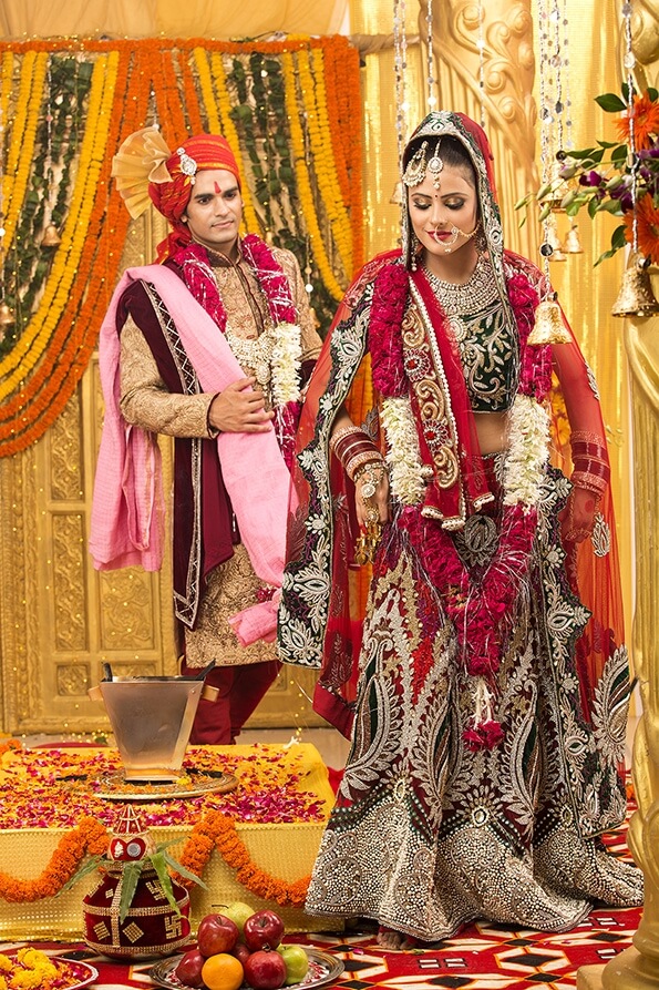 indian bride and groom taking pheras