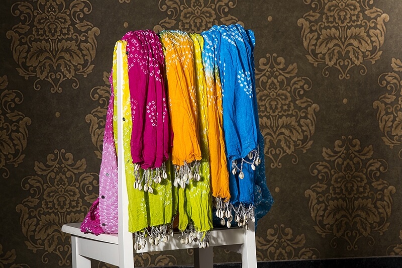 multi coloured dupatta hanging 