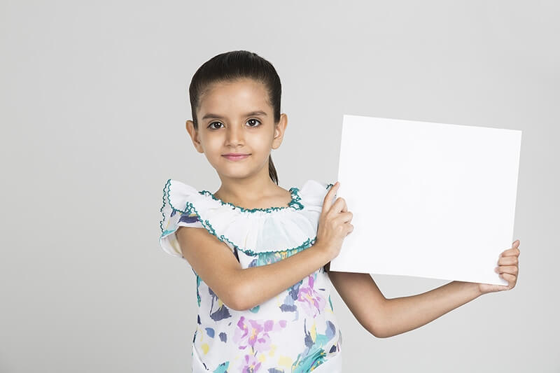 cute girl showing blank placard