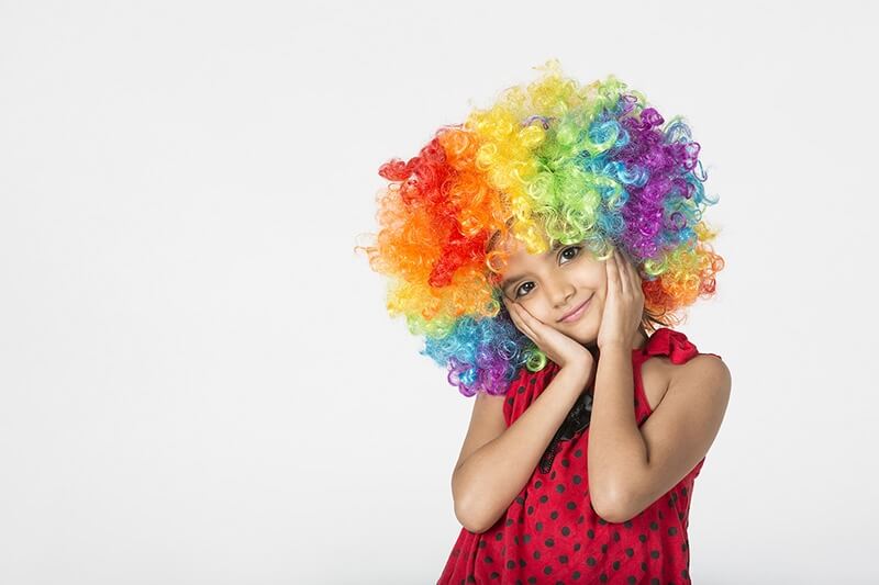 cute girl wearing colourful wig