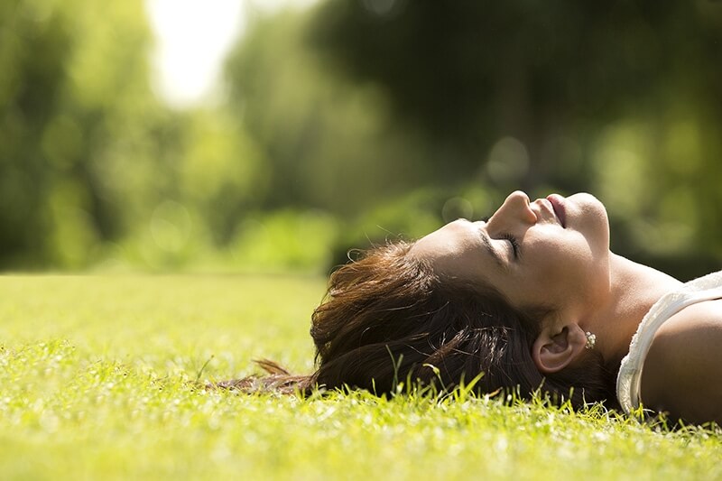 woman lying on grass 