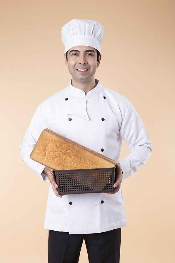 chef with fresh loaf of bread