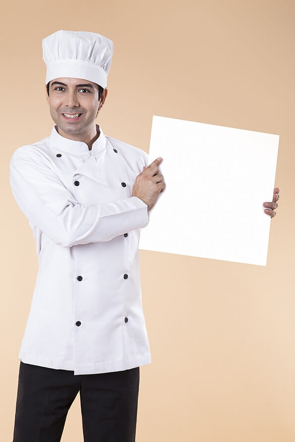 chef pointing at placard