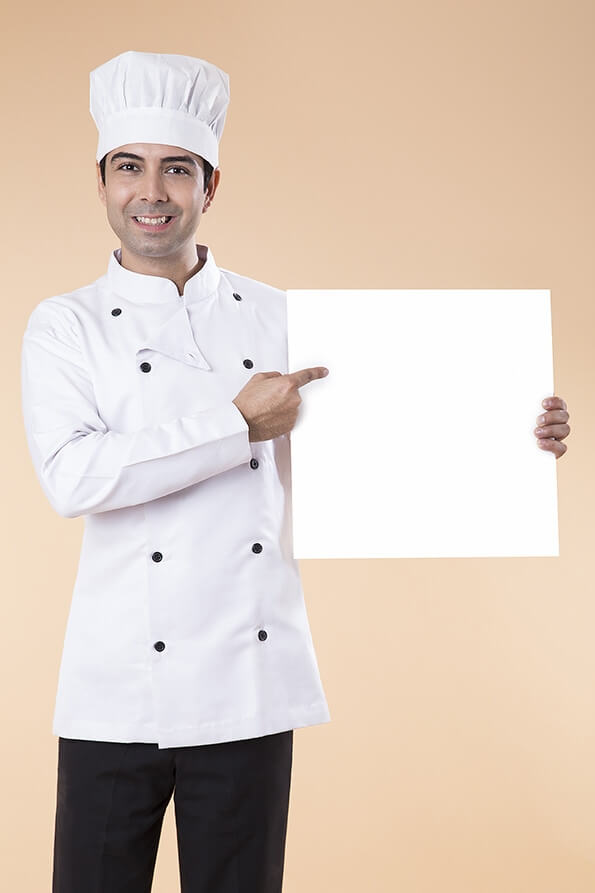 chef pointing at placard