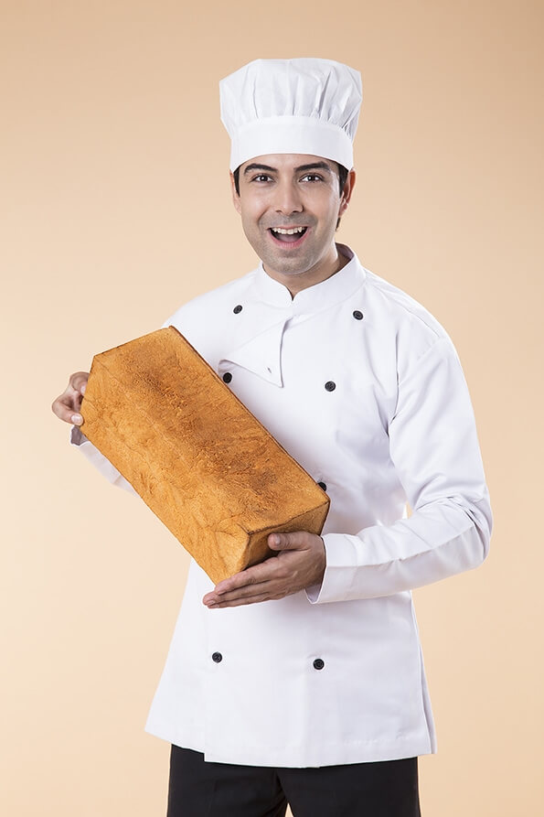 chef with fresh loaf of bread