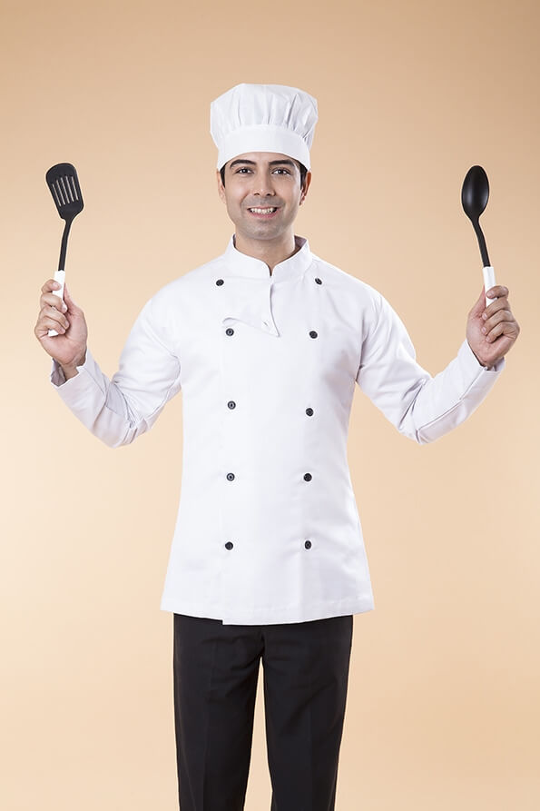 chef posing with spatula and ladle
