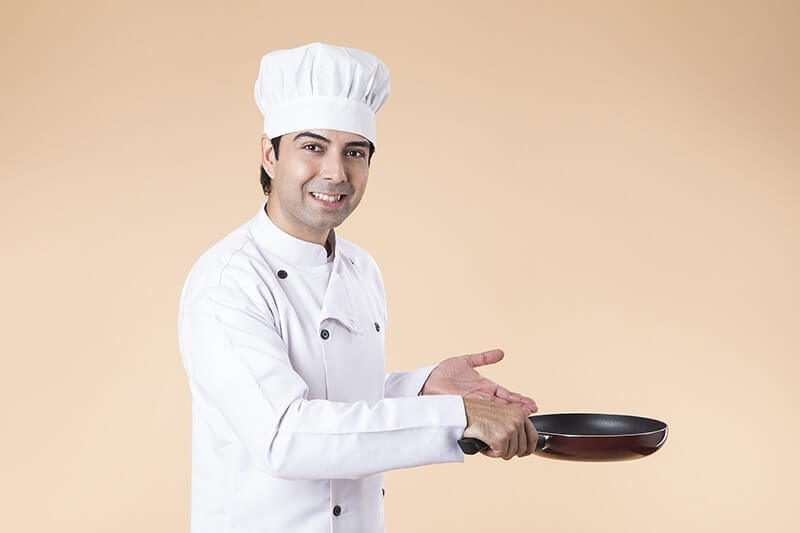 chef with frying pan