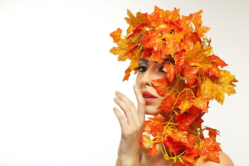 beautiful young woman portraying autumn