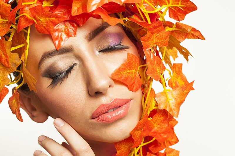 beautiful young woman portraying autumn