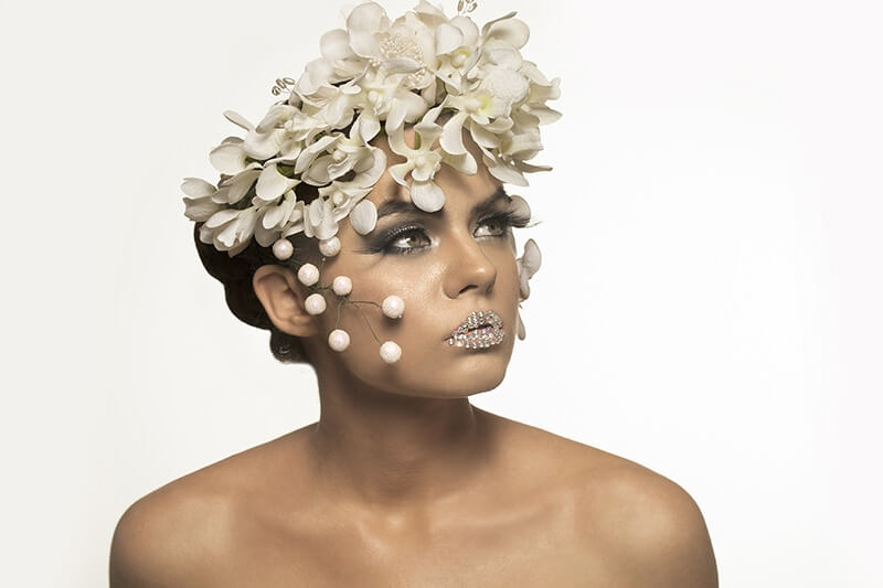 woman covered with white flowers
