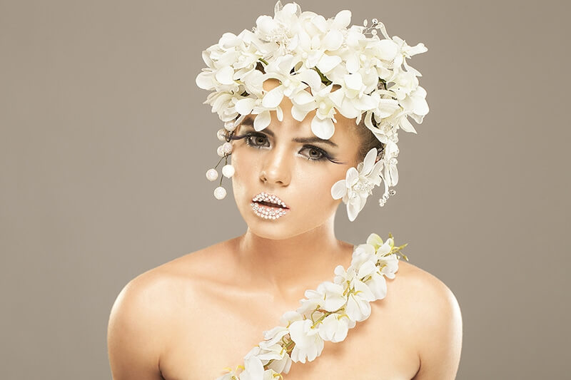 woman covered with white flowers
