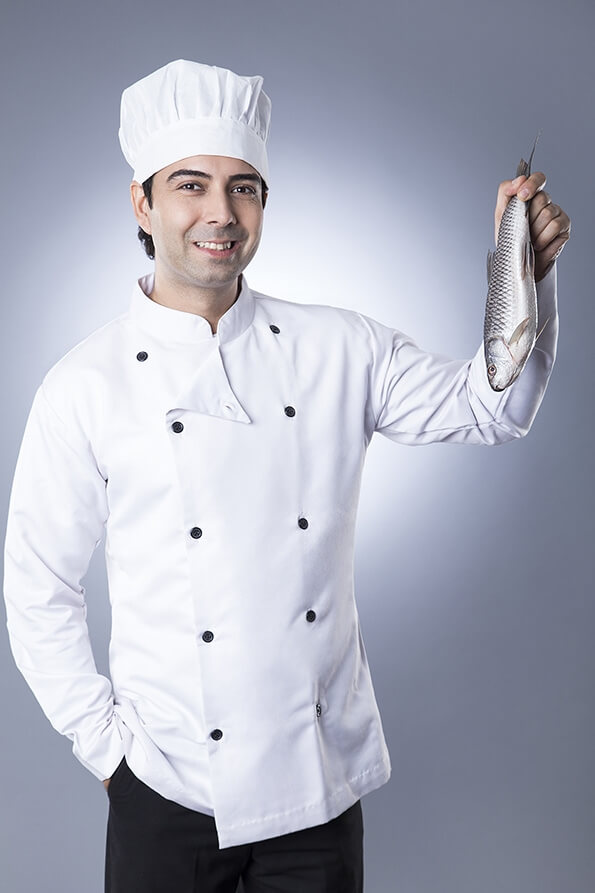 chef posing with fish