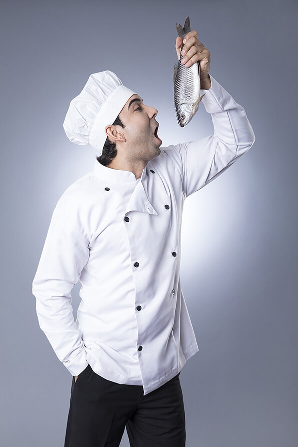 chef posing with fish 