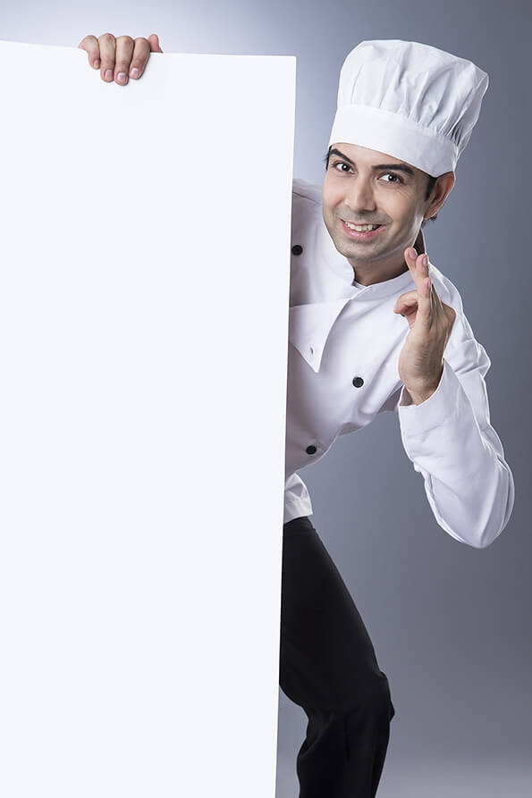 chef gesturing with placard