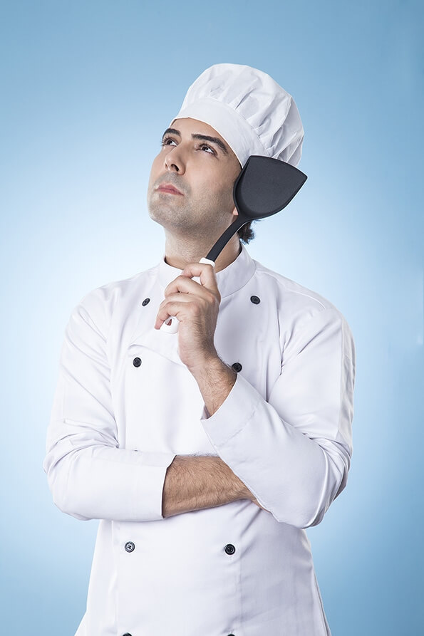 chef thinking with spatula in hand