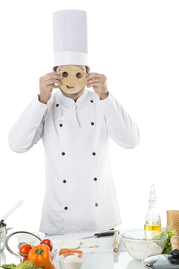 chef posing with mask made up of chapati