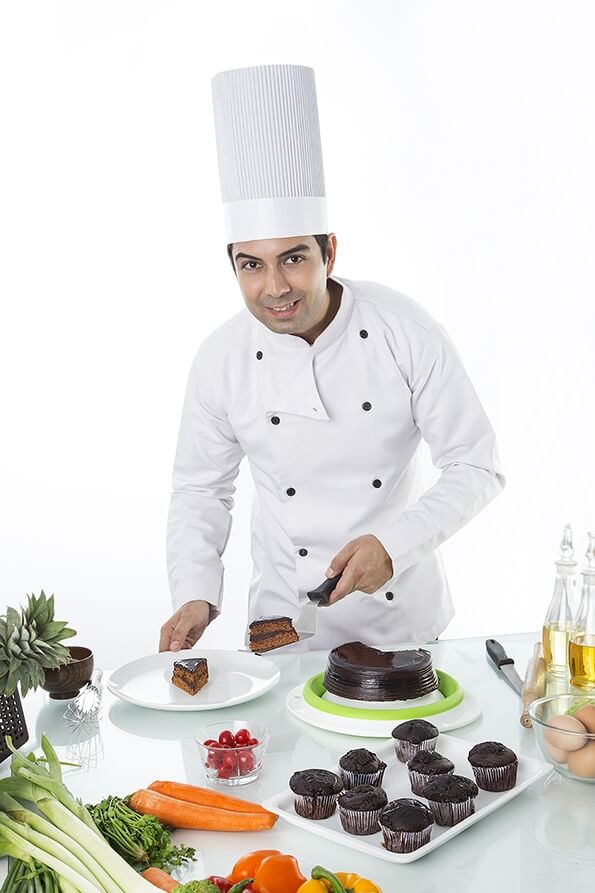 chef with cake and muffins 