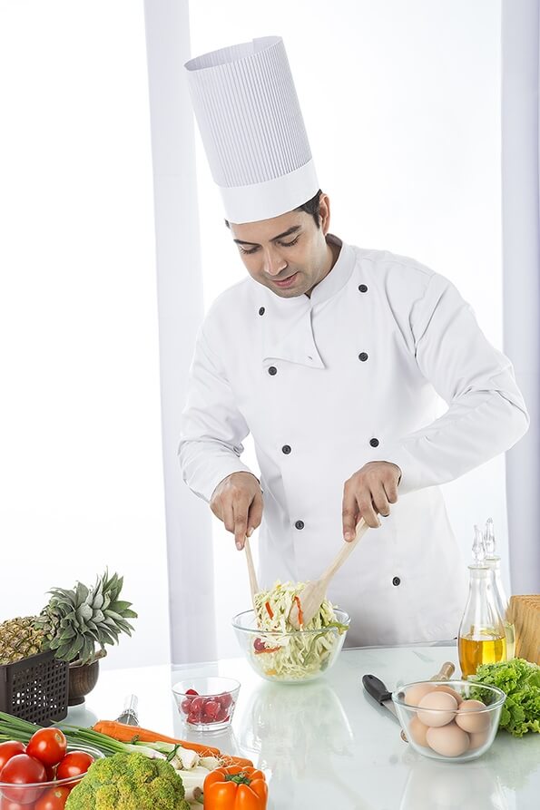 chef churning salad