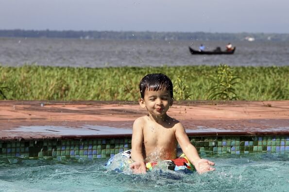 child playing in swimming pool