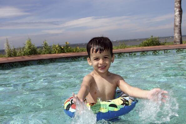 child playing in swimming pool