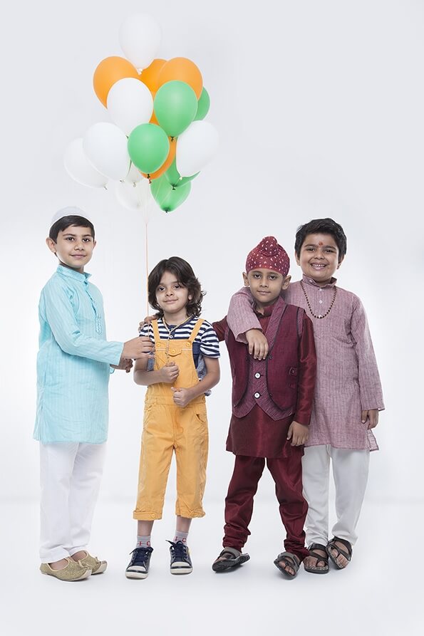 kids from different religions with balloons 