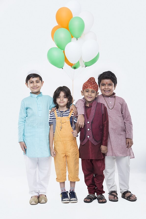 kids from different religions with balloons 