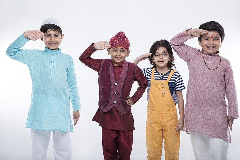 four kids from different religion saluting