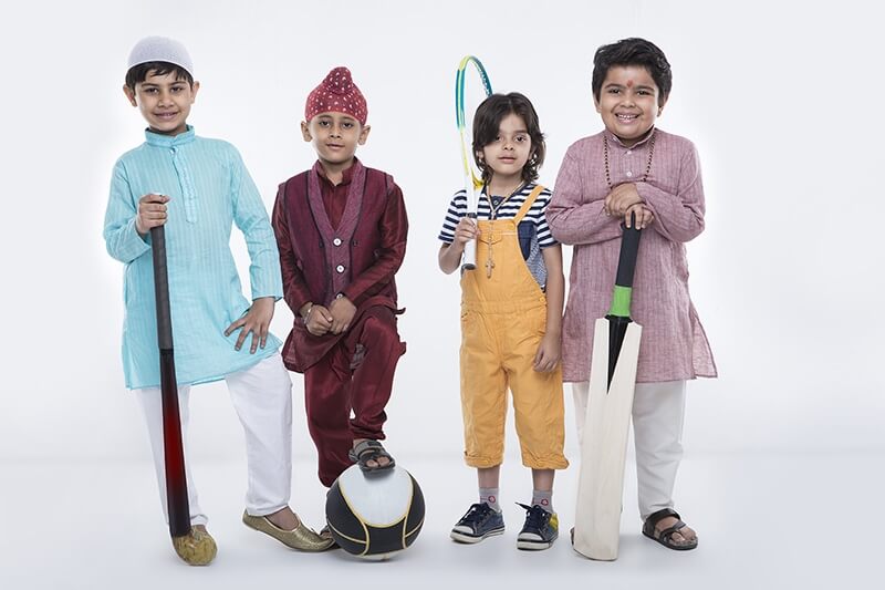 kids from different religions with sports equipments 