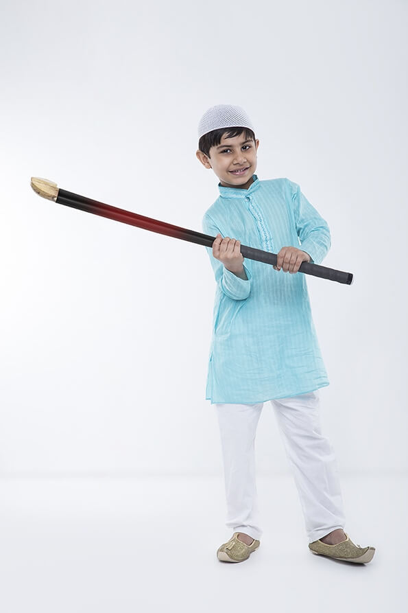 muslim boy with hockey stick 