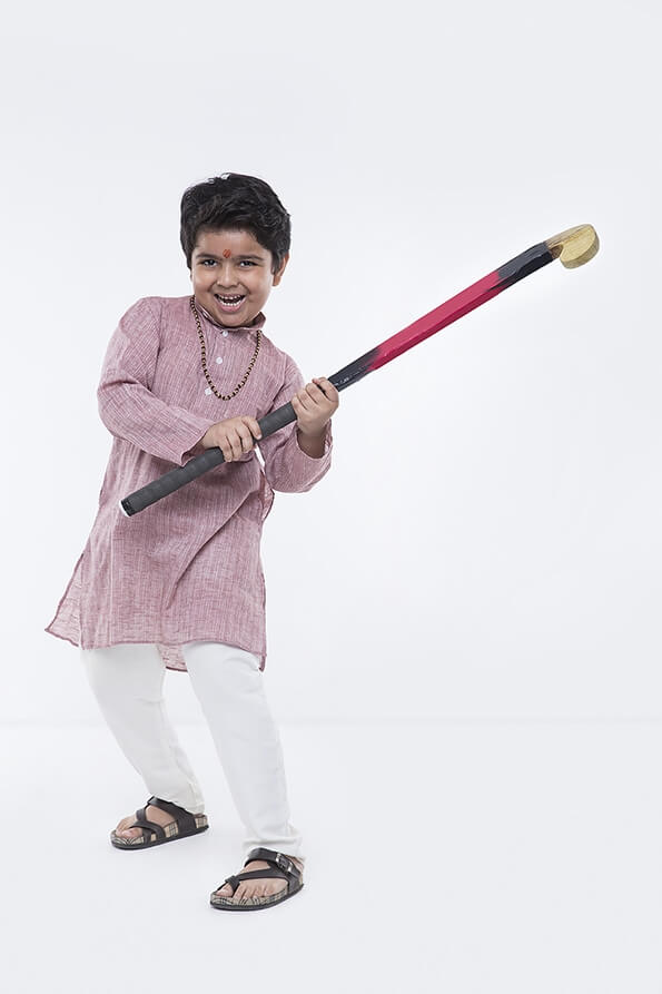 hindu boy with hockey stick 