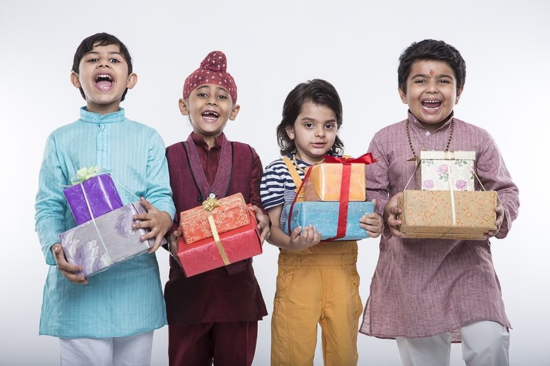kids from different religions with gifts 
