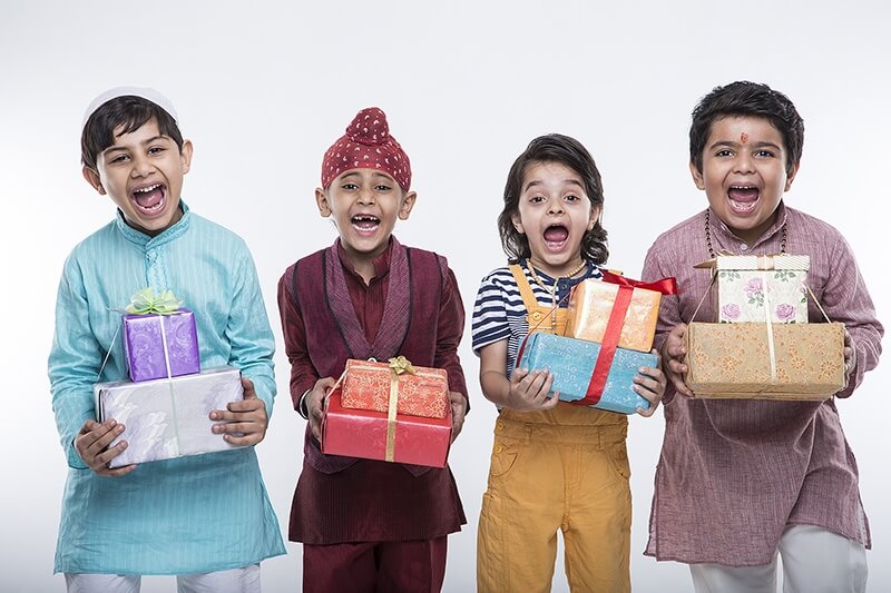 kids from different religions with gifts 