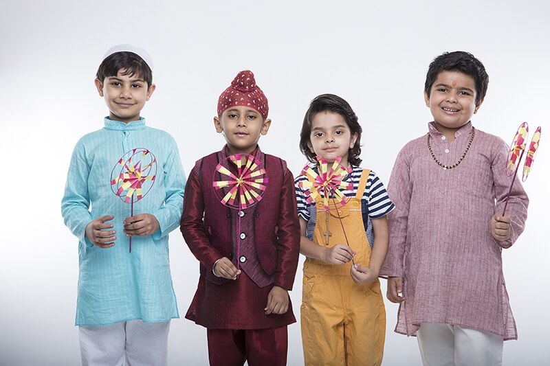 kids from different religions with windmill toy