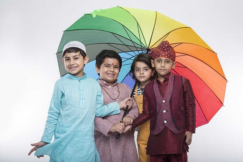 four kids from different religion under one umbrella