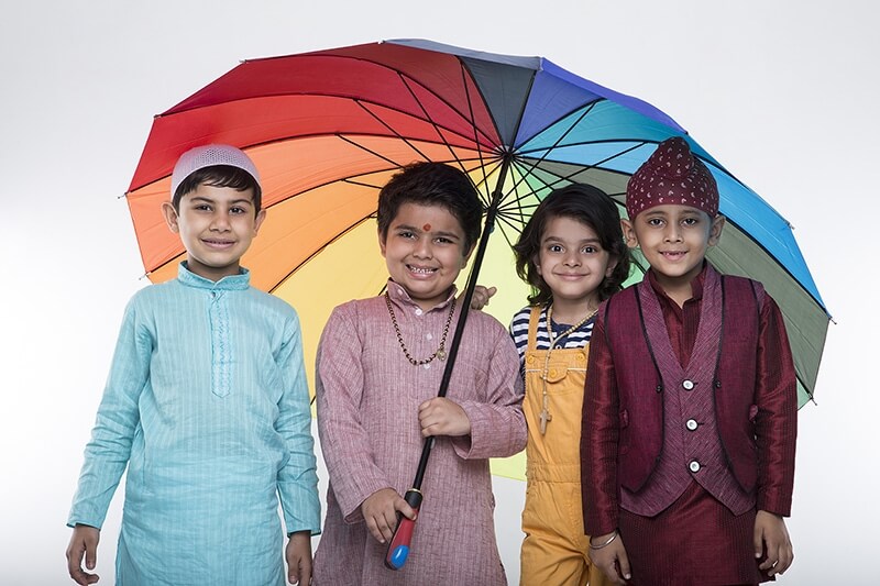 four kids from different religion under one umbrella