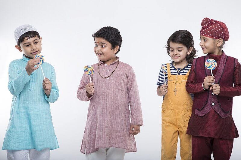 four kids posing with candy 