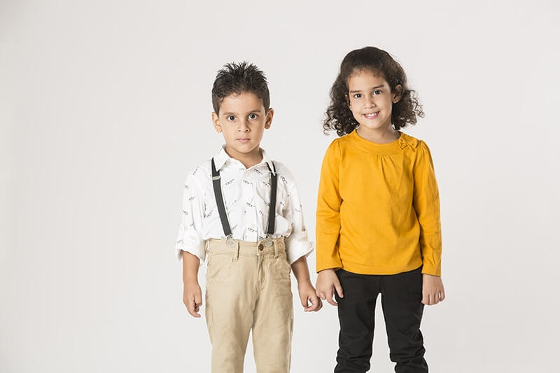 two kids posing and smiling