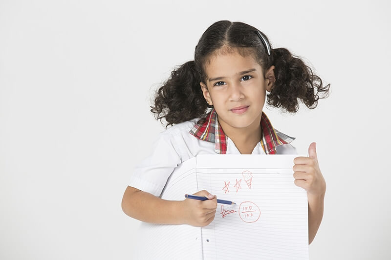 school kid showing her test grades