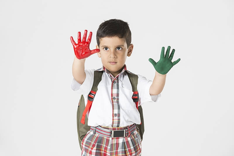 kid showing his painted hands 