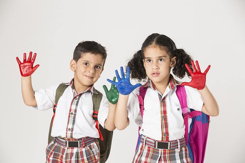 school kids with painted hands
