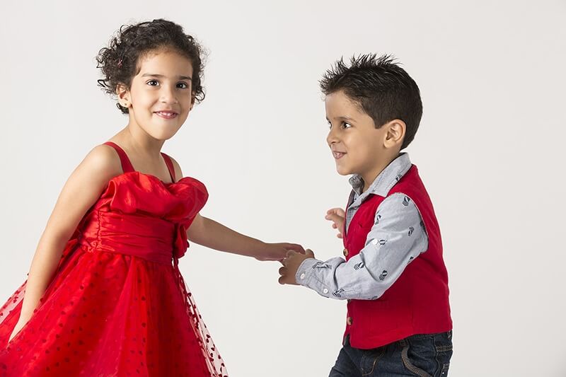 two cute little kids dancing