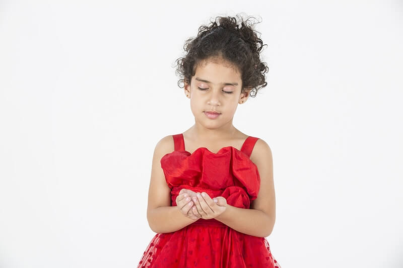 girl wearing red dress gesturing