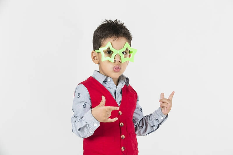 boy wearing colourful glasses