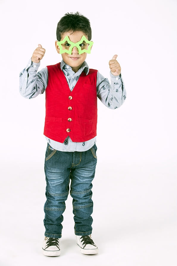 boy wearing colourful glasses