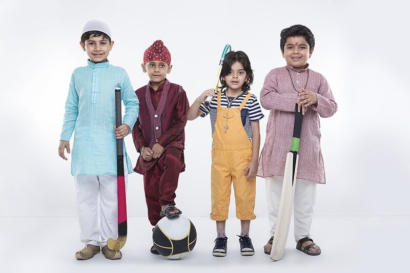 kids from different religions with sports equipments 