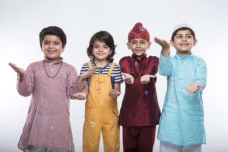 kids from different religions showing their hands 