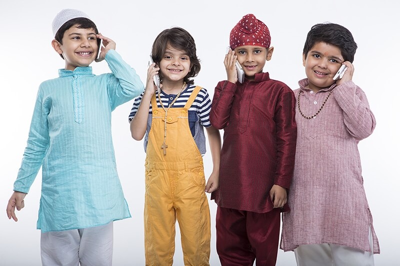 kids from different religions with mobile phones 