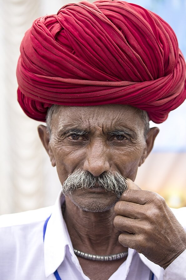 villager with moustache posing at pushkar camel fair